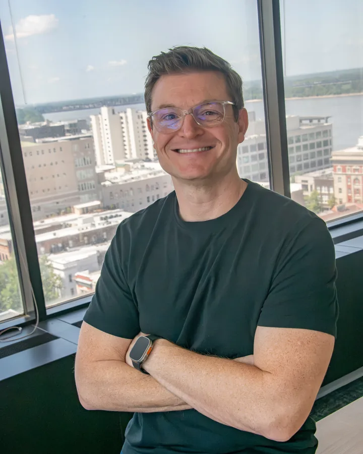 Michael Newsome by the office windows in downtown Memphis